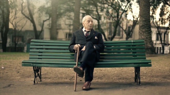 Jorge Luis Borges on park bench with cane